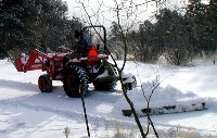 PLOWING SNOW